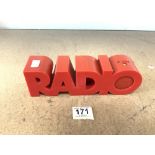 A 1980s RETRO RED PLASTIC RADIO, MAKER ISIS.
