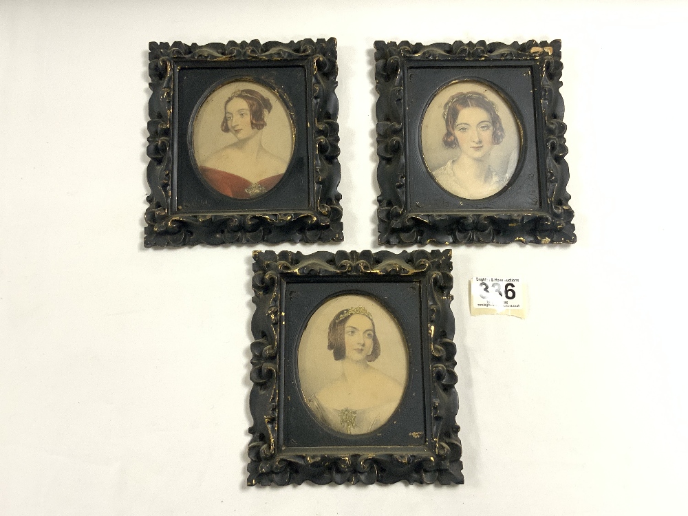 A SET OF THREE VICTORIAN OVAL COLOURED ENGRAVINGS - PORTRAITS OF LADIES, IN CARVED ORNATE FRAMES,