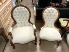 A PAIR OF VICTORIAN STYLE SHOWOOD BUTTON BACK MUMMY AND DADDY CHAIRS.