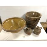 A GLAZED STONEWARE CREAM BOWL, 46 CMS, A VINTAGE WOODEN WATER BUCKET AND TWO STONEWARE JUGS,