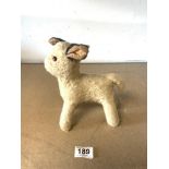 A VINTAGE STRAW-FILLED TOY LAMB WITH GLASS EYES.