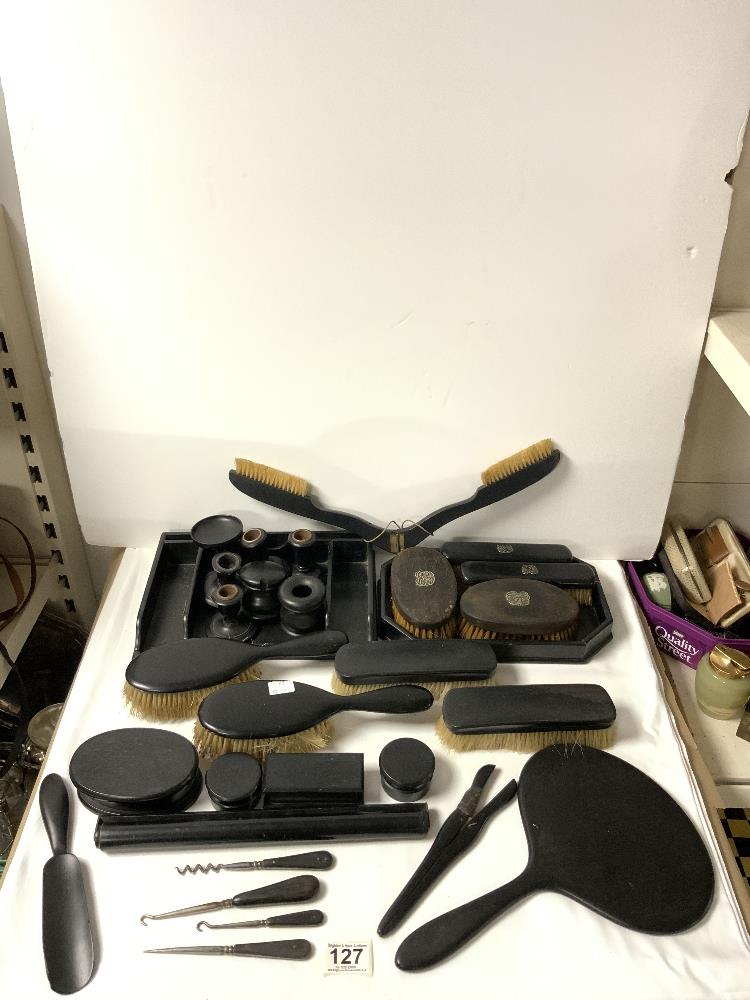 A QUANTITY OF EBONISED DRESSING TABLE ITEMS.