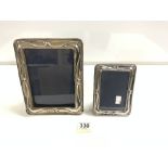 A GRADUATED PAIR OF ART NOUVEAU DESIGN HALLMARKED SILVER RECTANGULAR PHOTO FRAMES, LONDON 1987,