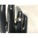 VINTAGE 375 GOLD RING WITH A CENTRAL OPAL SURROUNDED WITH SAPPHIRES SIZE N