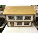 A PAINTED WOODEN DOLLS HOUSE - 60X45.