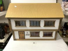 A PAINTED WOODEN DOLLS HOUSE - 60X45.