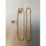 TWO CULTURED PEARL NECKLACES, BOTH WITH 375 MARKED CLASPS.