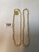TWO CULTURED PEARL NECKLACES, BOTH WITH 375 MARKED CLASPS.
