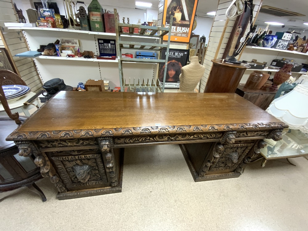 A VICTORIAN CARVED OAK LIONS HEAD AND FIGURE DECORATED PEDESTAL SIDEBOARD, 216X70X90.