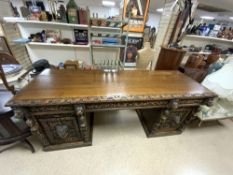 A VICTORIAN CARVED OAK LIONS HEAD AND FIGURE DECORATED PEDESTAL SIDEBOARD, 216X70X90.