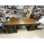 A VICTORIAN CARVED OAK LIONS HEAD AND FIGURE DECORATED PEDESTAL SIDEBOARD, 216X70X90.