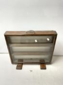 A SLIM GLAZED TABLE TOP DISPLAY CABINET, 50X40 CMS.