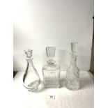 A WATERFORD CUT CRYSTAL GLASS BELL SHAPE DECANTER, 34 CMS, AND TWO OTHER GLASS DECANTERS.
