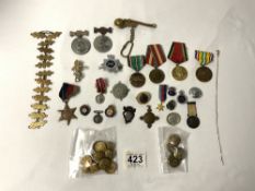A QUANTITY OF BADGES AND MEDALS.