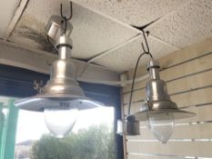 A PAIR OF POLISHED ALUMINIUM INDUSTRIAL STYLE HANGING LAMPS.