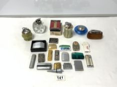 A COLLECTION OF TABLE AND POCKET LIGHTERS, COLIBRI, RONSON, MAZE AND MORE.
