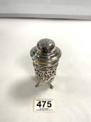 HALLMARKED SILVER CIRCULAR PIERCED SUGAR SIFTER WITH CRANBERRY GLASS LINER ON SHELL SUPPORTS WITH