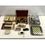 TWO SETS OF DOMINOS, LOOSE DOMINOS, CHESS SET, TOY VEHICLES, CIRCULAR PLAYING CARDS AND MORE.