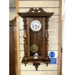 A LATE VICTORIAN VIENNA WALL CLOCK WITH CIRCULAR ENAMEL DIAL.