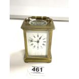 A FRENCH BRASS CARRIAGE TIMEPIECE, WITH WHITE ENAMEL DIALAND ROMAN NUMERALS.