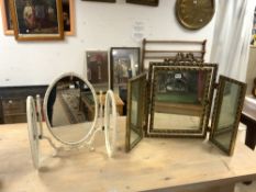 A GILT TRIPLE FOLDING DRESSING TABLE MIRROR, AND OVAL EMBOSSED TRIPLE FOLDING MIRROR.