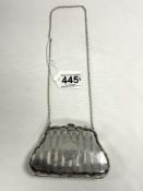 A HALLMARKED SILVER ENGINE TURNED PURSE WITH CAST BORDER, WITH CHAIN LINK HANDLE, BIRMINGHAM 1915,