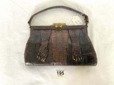 A VINTAGE CROCODILE HANDBAG.