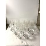 A SET OF TWELVE ETCHED GLASS LONG DRINKING GLASSES, AND SET OF SIX ENGRAVED SUNDAE GLASSES.