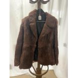 A BROWN FUR COAT, SIZE 14,