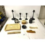 A PAIR OF EBONY CANDLESTICKS, 20 CMS, EBONY DESK CLOCK, AND 1950s PLASTIC MANICURE ITEMS WITH TRAY.