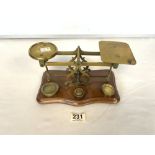 A SET OF VICTORIAN BRASS POSTAL SCALES AND WEIGHTS.