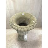 A RECONSTITUTED STONE FLUTED GARDEN URN, 68X46.
