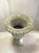 A RECONSTITUTED STONE FLUTED GARDEN URN, 68X46.