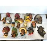 A QUANTITY OF BOSSONS PLASTER CHARACTER WALL MASKS.