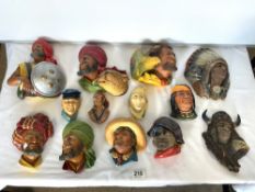 A QUANTITY OF BOSSONS PLASTER CHARACTER WALL MASKS.