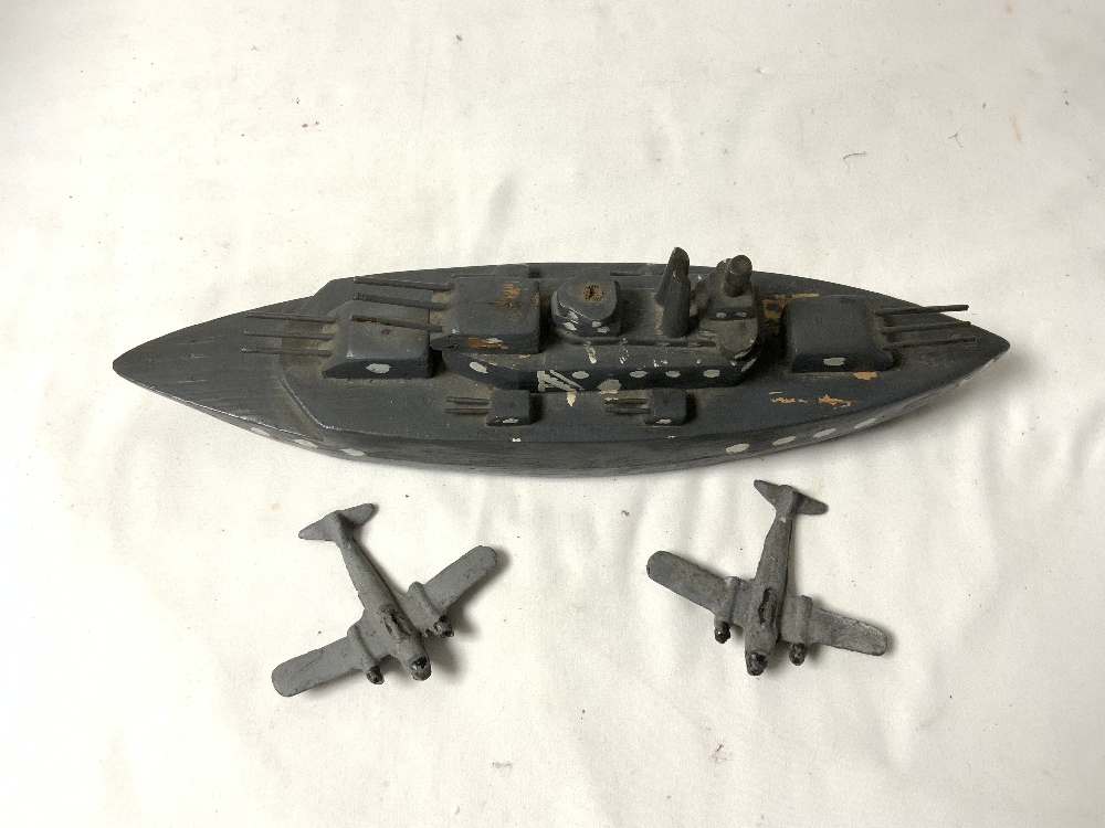 A PAINTED SCRATCH BUILT WOODEN GERMAN BATTLE SHIP - 1943, AND TWO LEAD METAL BOMBERS. - Image 3 of 4
