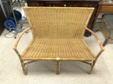 A WICKER TWO SEATER CONSERVATORY CHAIR.