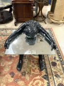 A BLACK COMPOSITE NUDE WOMAN HOLDING MIRROR COFFEE TABLE.