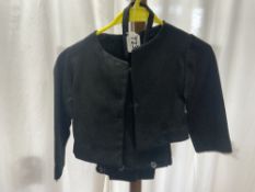 A CHILDS VINTAGE BLACK JACKET AND TROUSERS.