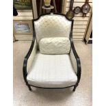 AN ANTIQUE FRENCH EBONISED CHAIR WITH PLEATED SILK AND MATCHING CUSHION