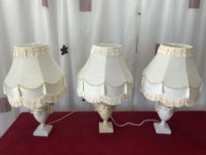 A SET OF THREE CLASSICAL DESIGN URN SHAPED TABLE LAMPS WITH SHADES, 32 CMS.