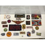 A QUANTITY OF HEAVY METAL CLOTH BADGES FOR MOTORHEAD, AC/DC, MEAT LOAF, JUDAS PRIEST, AND OTHER