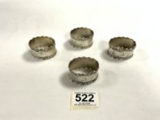 SET OF FOUR EDWARDIAN HALLMARKED SILVER OVAL NAPKIN RINGS WITH CAST BORDERS DATED 1905 BY HENRY
