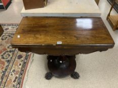 EARLY VICTORIAN ROSEWOOD CARD TABLE ON CIRCULAR BASE WITH CLAW FEET.