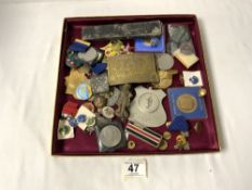 A BRASS INDIAN HEAD BELT BUCKLE, MEDALS FOR ARCHERY, MIXED BADGES, RONSON LIGHTER, AND MORE.