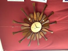 A MID-CENTURY WOODEN SUNBURST WALL CLOCK, CONVERTED TO BATTERY MOVEMENT.