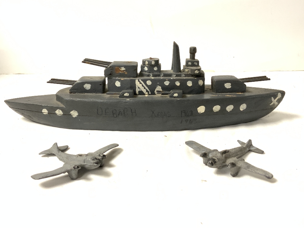 A PAINTED SCRATCH BUILT WOODEN GERMAN BATTLE SHIP - 1943, AND TWO LEAD METAL BOMBERS. - Image 2 of 4