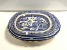 THREE VICTORIAN BLUE AND WHITE WILLOW PATTERN MEAT PLATES, AND ONE OTHER.