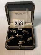 A SET OF SIX SILVER PLATED PIG CARD HOLDERS.