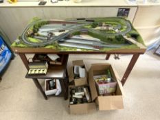 ASSEMBLED MODEL RAILWAY WITH TRAINS CARRIAGES AND ACCESSORIES, WITH A TRANSFORMER.